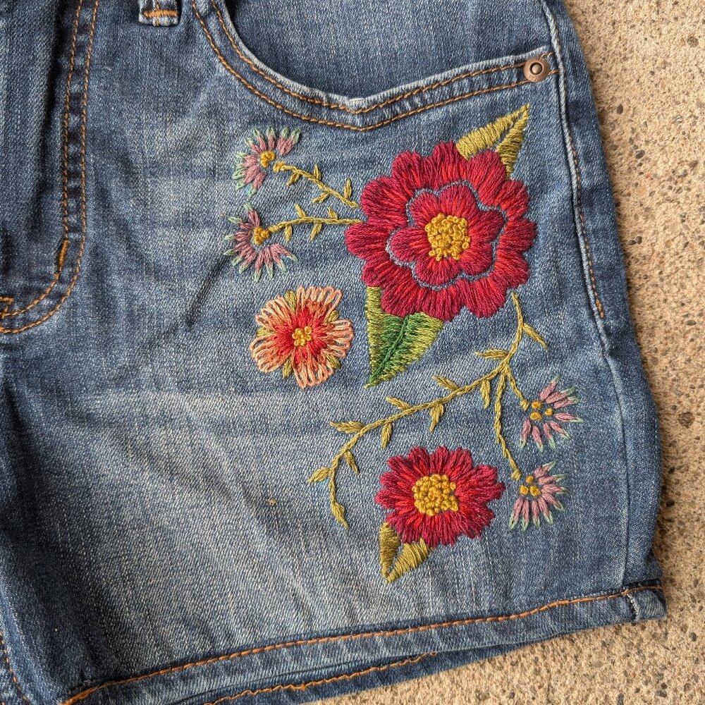 Hand embroidered floral jean shorts midrise